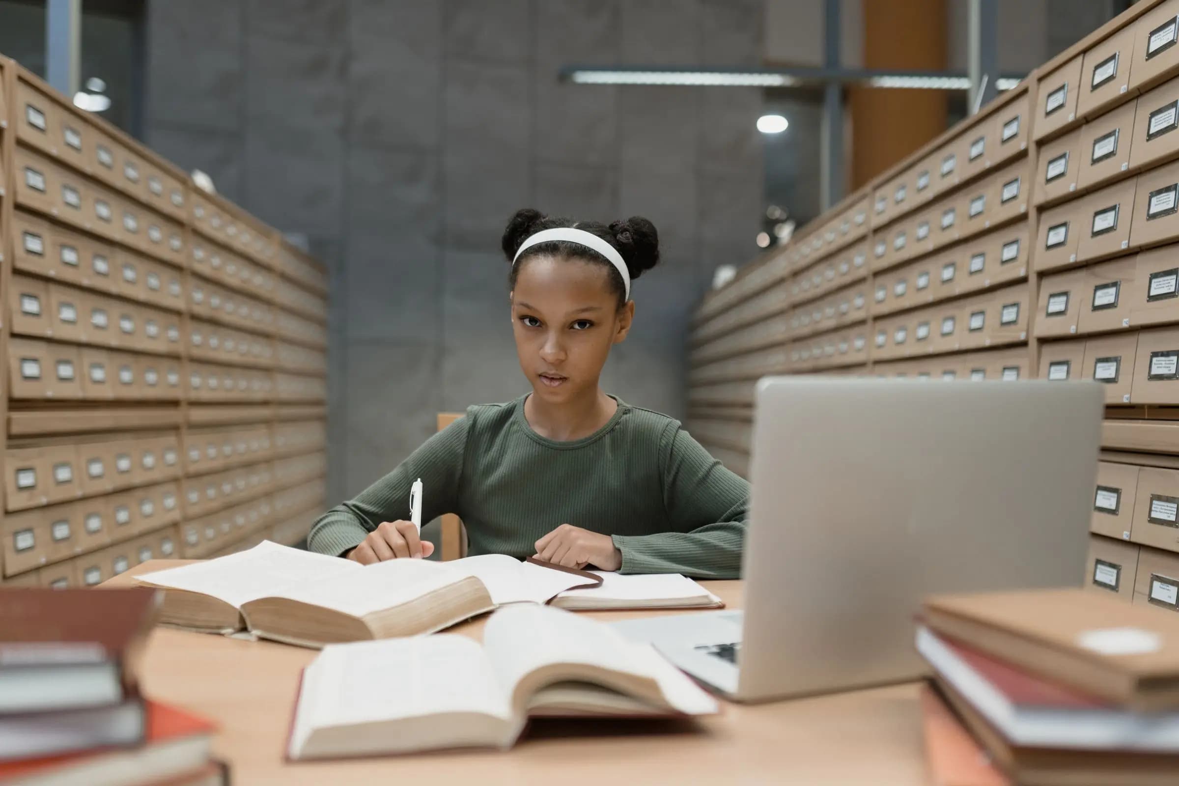 A girl studying in a school library